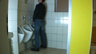 Guy fucks a mature in a public bathroom