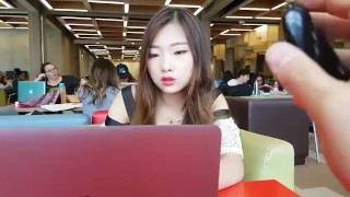Cute asian girl with remote vibe outside